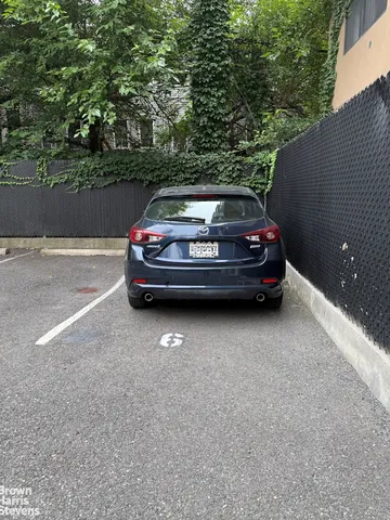 a view of yard with car parked