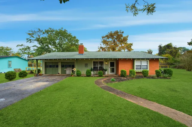 front view of a house with a garden