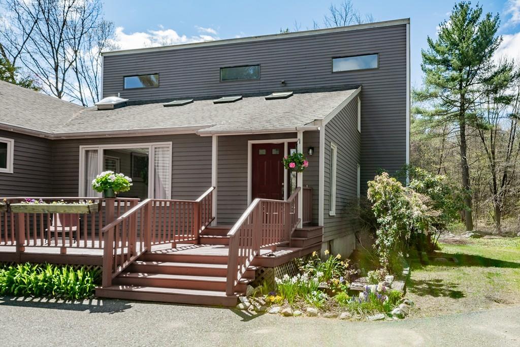 51 Cobleigh Road Boxborough, MA 01719 - Photo 1 of 32 a front view of a house with a yard