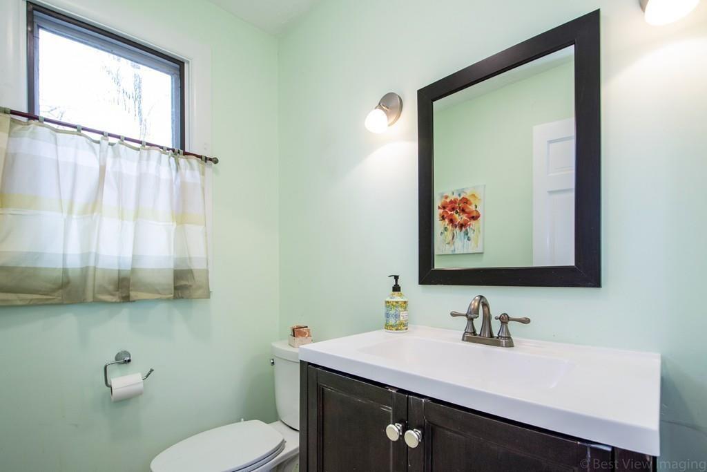 51 Cobleigh Road Boxborough, MA 01719 - Photo 15 of 32 a bathroom with a sink vanity mirror and toilet