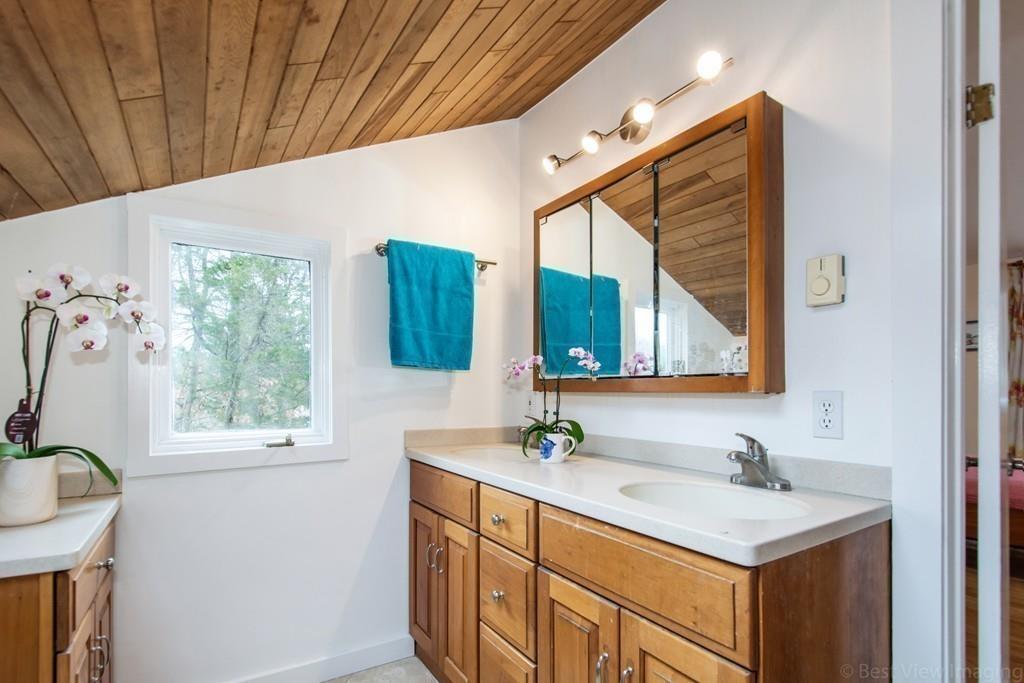 51 Cobleigh Road Boxborough, MA 01719 - Photo 18 of 32 a bathroom with a sink and a mirror