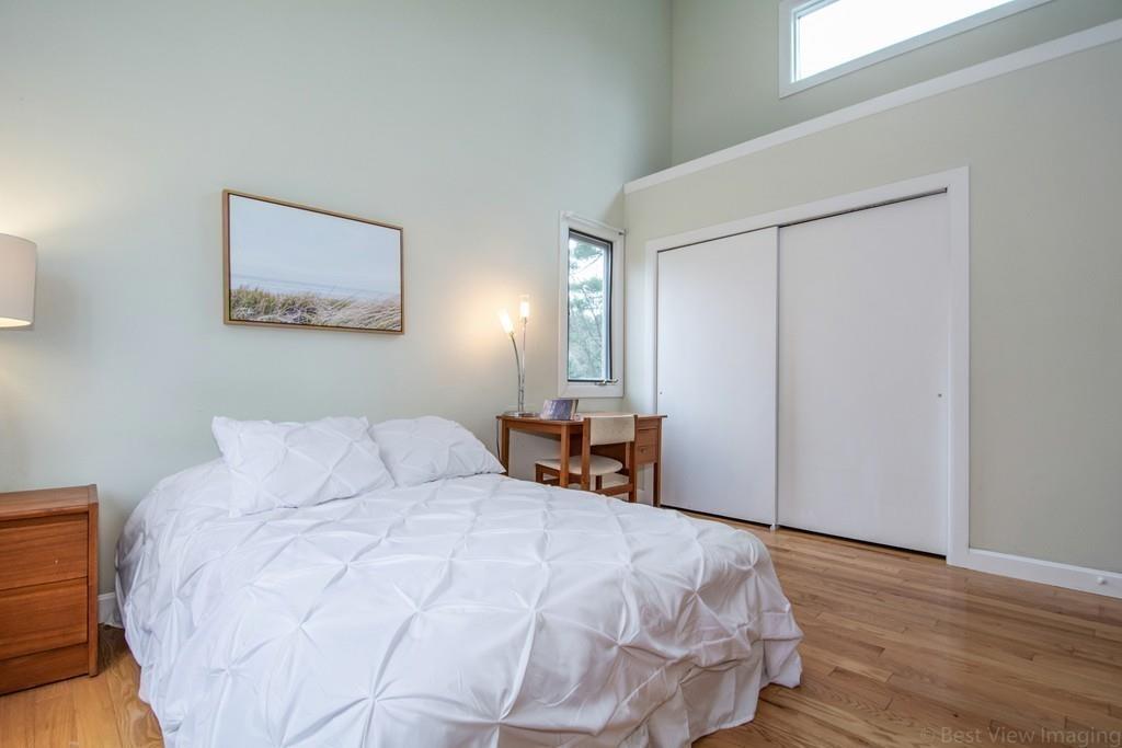 51 Cobleigh Road Boxborough, MA 01719 - Photo 20 of 32 a bedroom with a bed and wooden floor