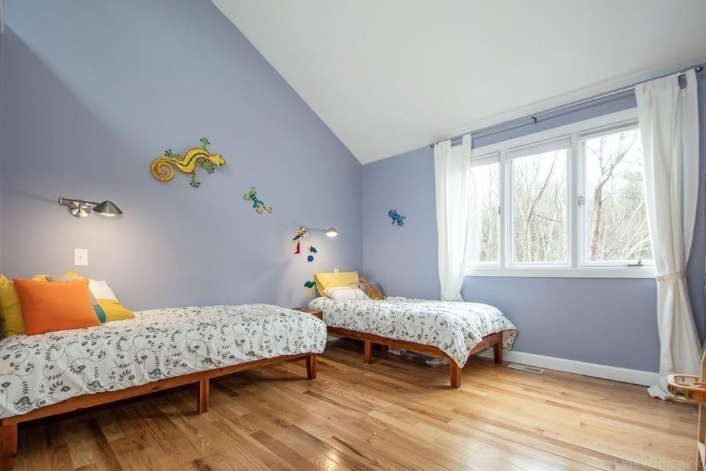 51 Cobleigh Road Boxborough, MA 01719 - Photo 21 of 32 a bedroom with a bed and a window