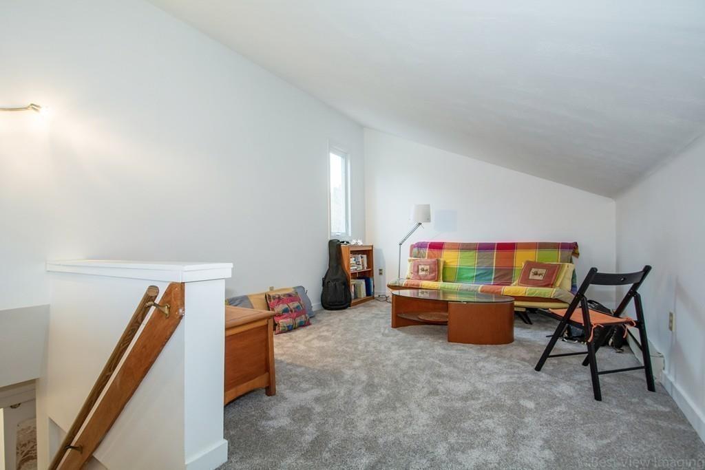 51 Cobleigh Road Boxborough, MA 01719 - Photo 23 of 32 a living room with furniture and a wooden floor