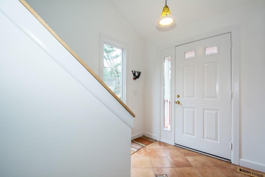 51 Cobleigh Road Boxborough, MA 01719 - Photo 25 of 32 a view of an entryway with wooden floor
