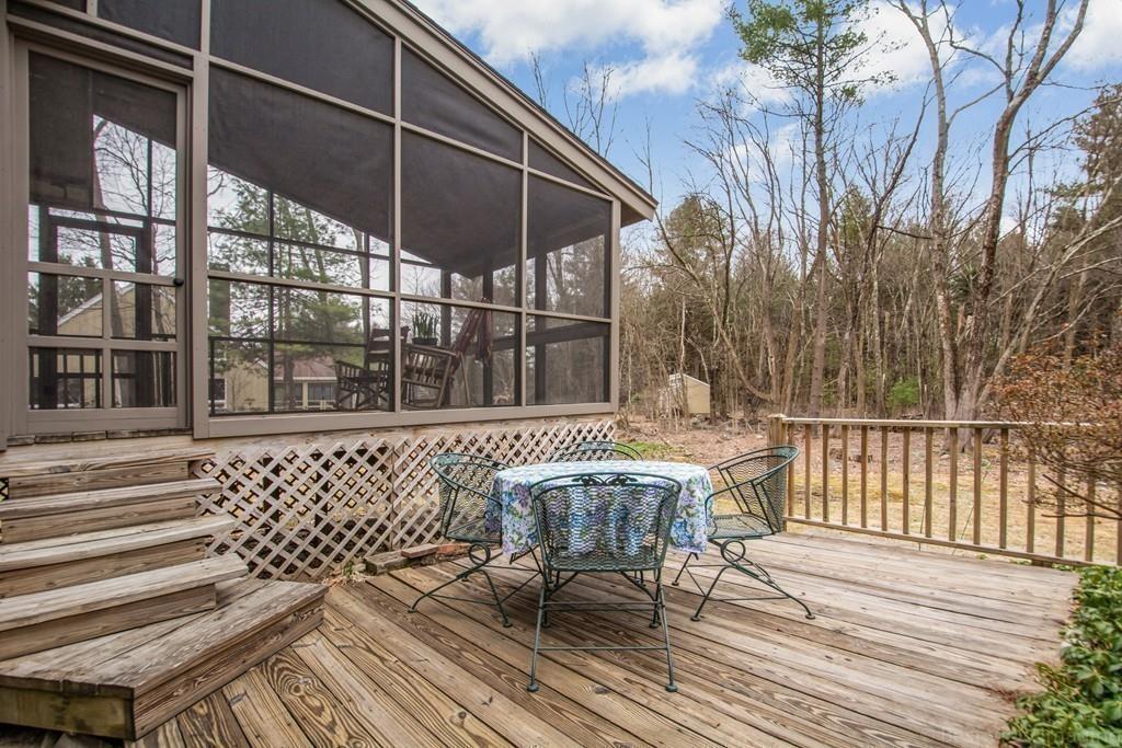 51 Cobleigh Road Boxborough, MA 01719 - Photo 27 of 32 a view of a chair and table on the deck