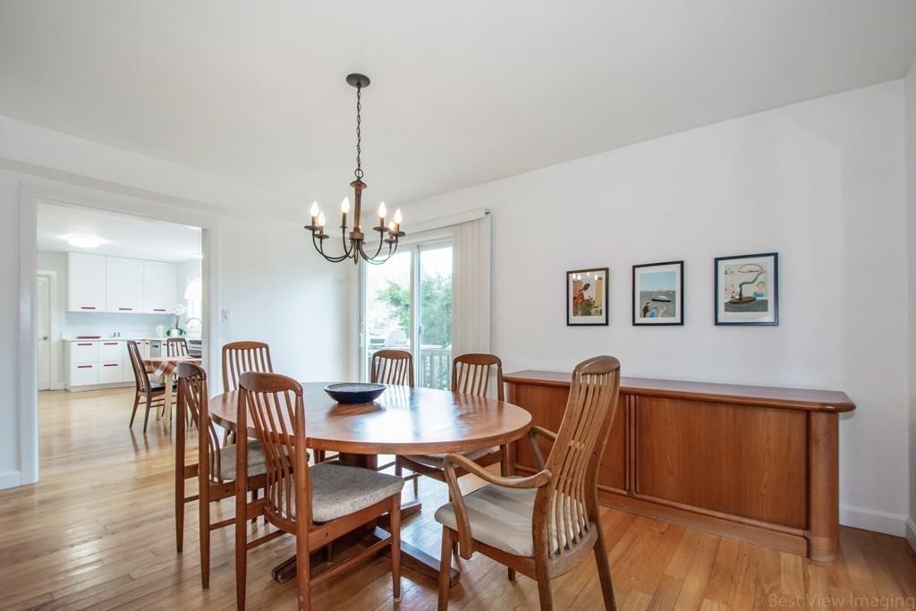 51 Cobleigh Road Boxborough, MA 01719 - Photo 9 of 32 a dining room with furniture a chandelier and wooden floor