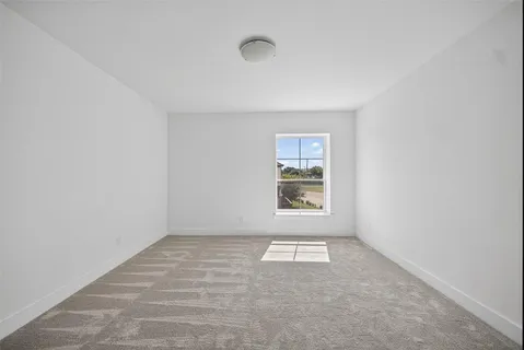 a white bath tub sitting next to a shower