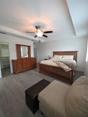 a bedroom with bed and window