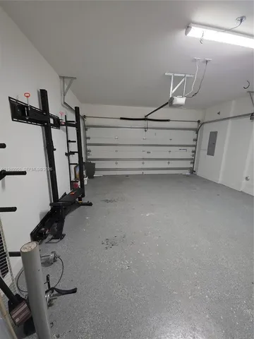 a view of room with air conditioner duct and empty racks