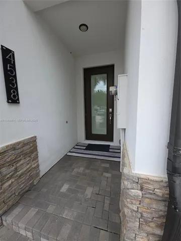 a view of a street with a car parked