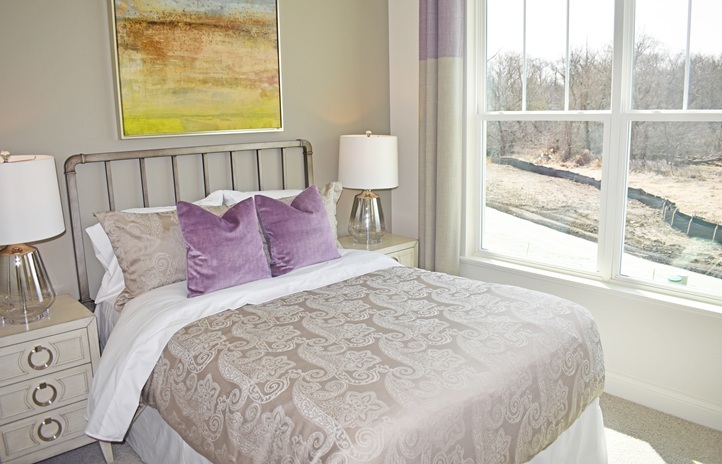 1174 Slade Road South Elgin, IL 60177 - Photo 16 of 18 a large bed sitting in a bedroom next to a window