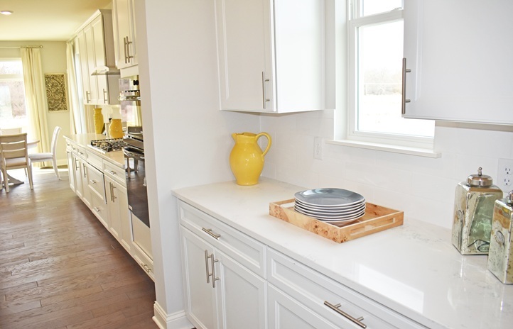 1174 Slade Road South Elgin, IL 60177 - Photo 4 of 18 a kitchen with a sink stove and cabinets