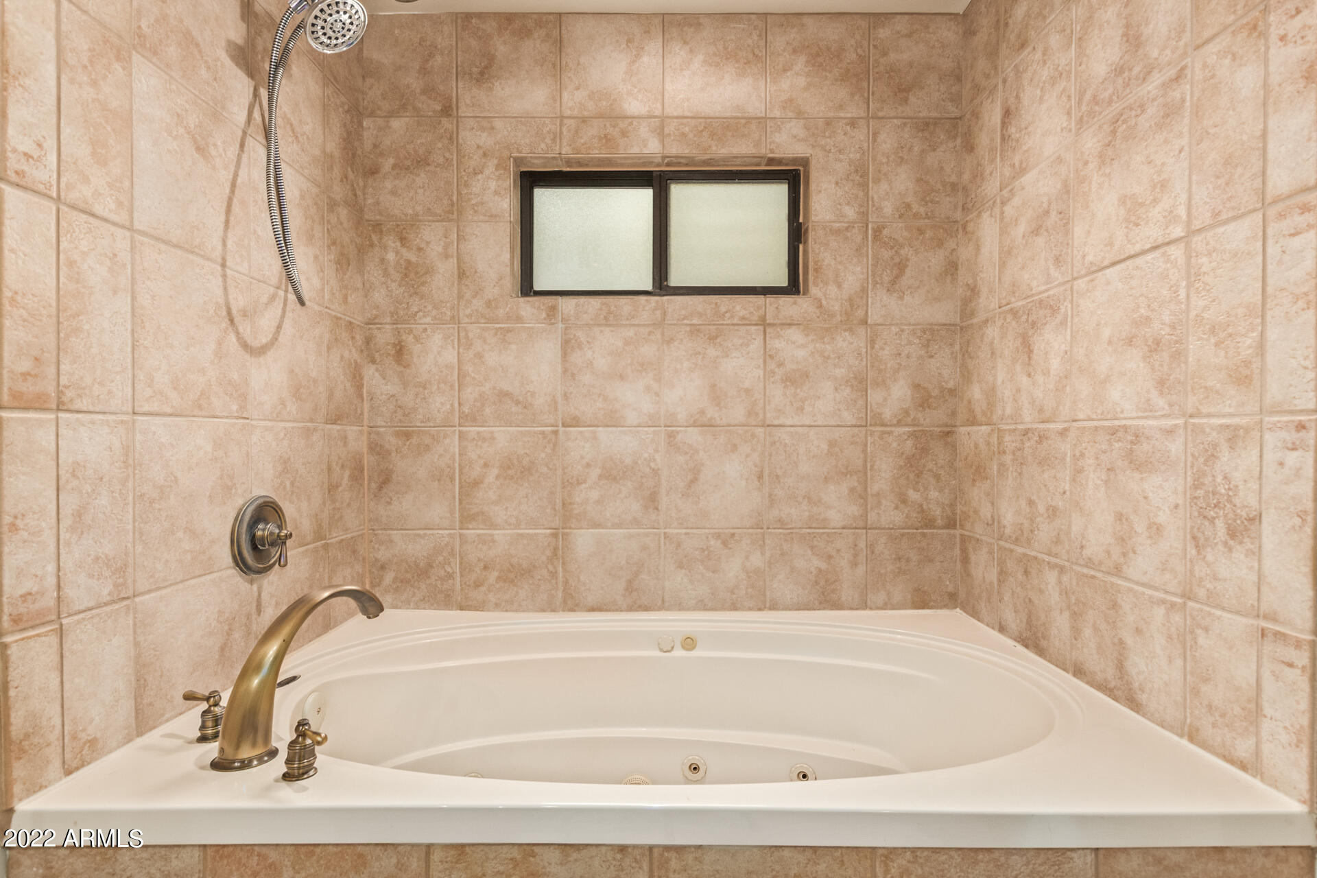 36601 North Mule Train Road, Unit A23 Carefree, AZ 85377 - Photo 13 of 26 a bathroom with a bathtub