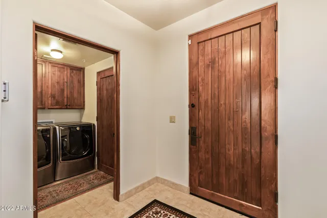a view of hallway with washer and dryer