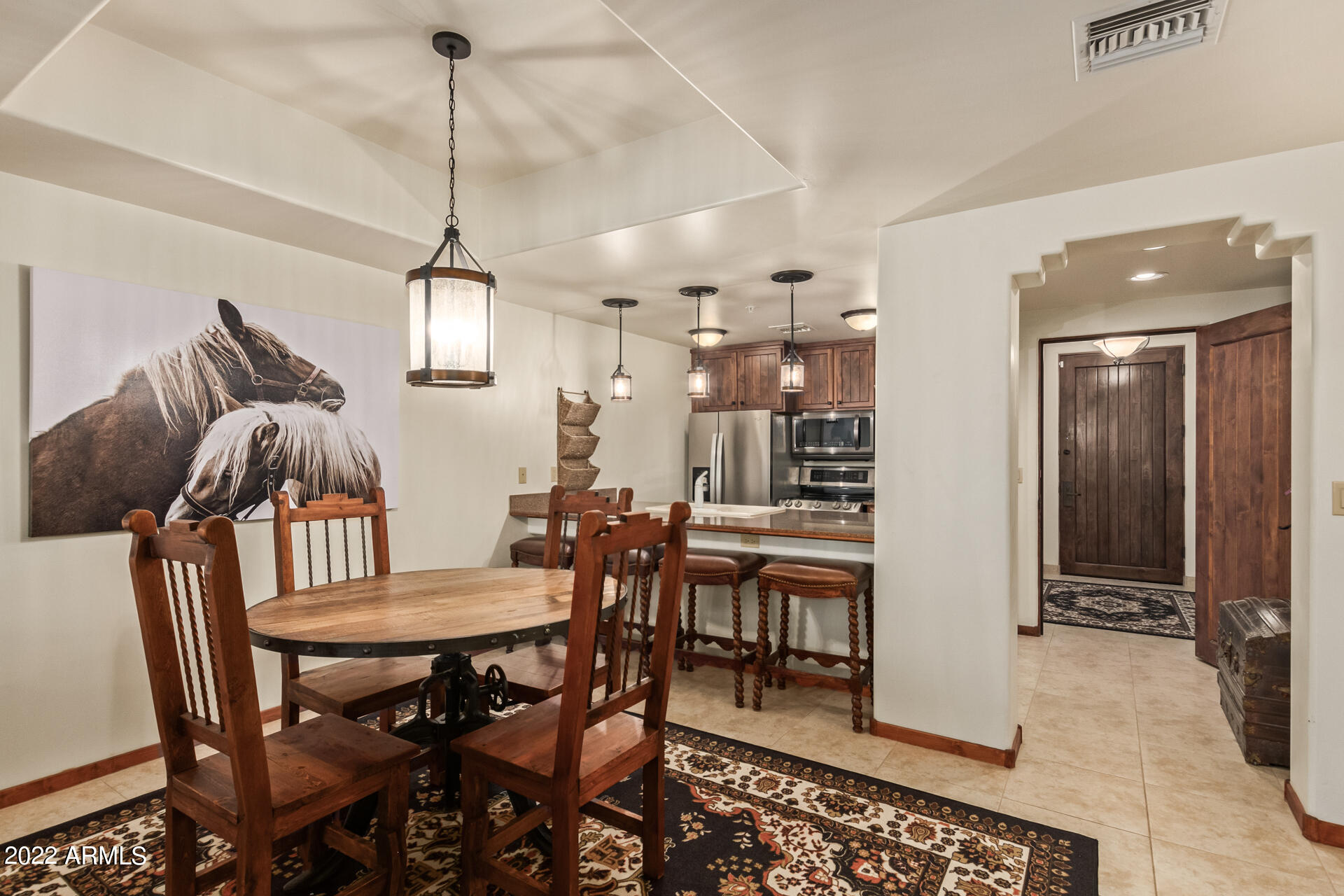 36601 North Mule Train Road, Unit A23 Carefree, AZ 85377 - Photo 3 of 26 a view of a dining room with furniture