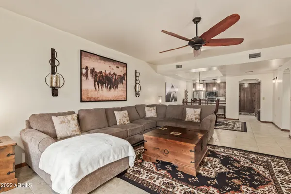 a living room with furniture and a rug