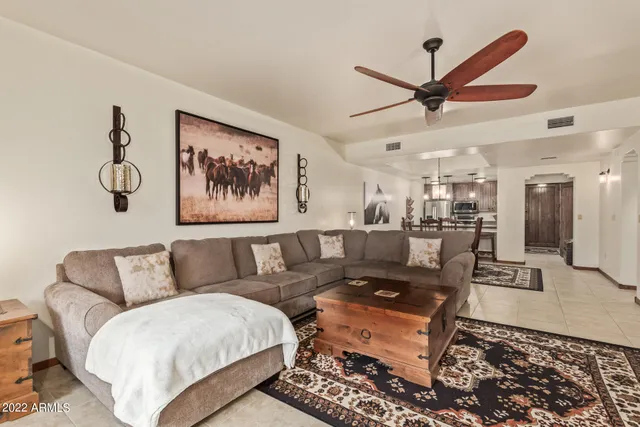 a living room with furniture and a rug