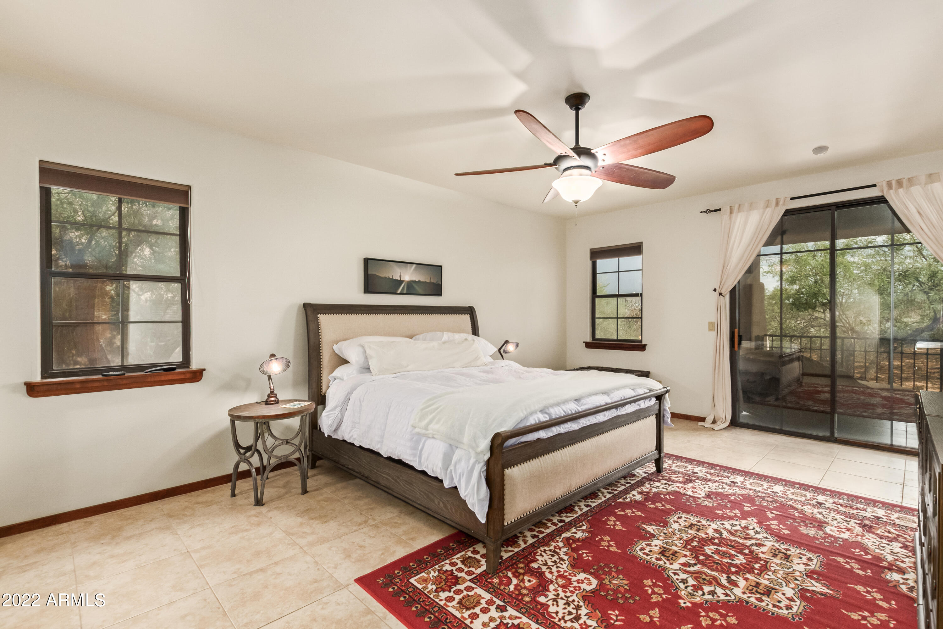 36601 North Mule Train Road, Unit A23 Carefree, AZ 85377 - Photo 9 of 26 a bedroom with a bed and a window