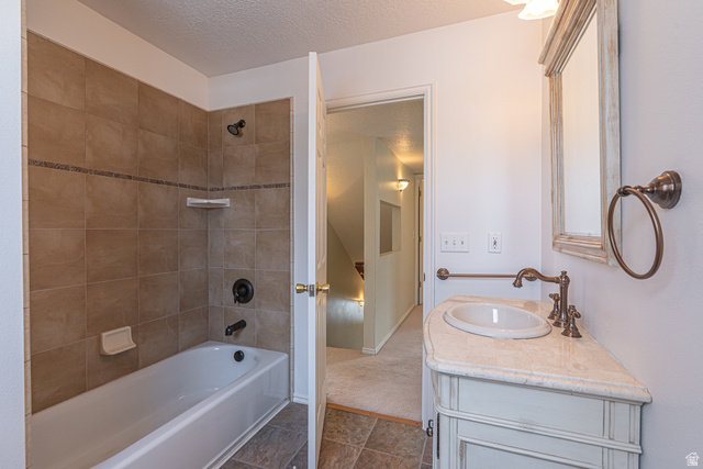 1045 Fox Farm Road Logan, UT 84321 - Photo 42 of 65 Full bathroom with tub / shower combination, vanity, and a textured ceiling