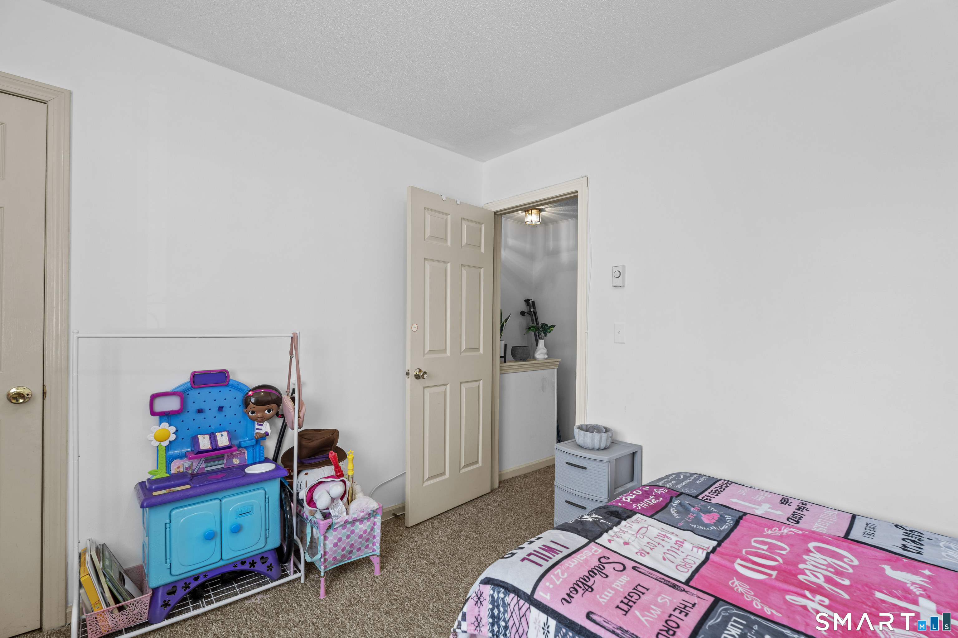 23 Pearl Lake Road, Unit B Waterbury, CT 06706 - Photo 12 of 14 a bedroom with a bed and a window