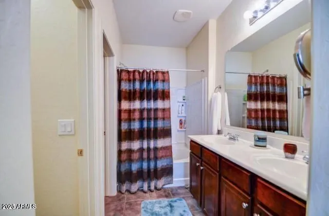 a bathroom with a sink double vanity and shower