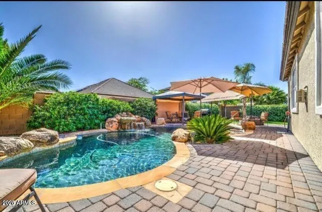 a view of a backyard with sitting area