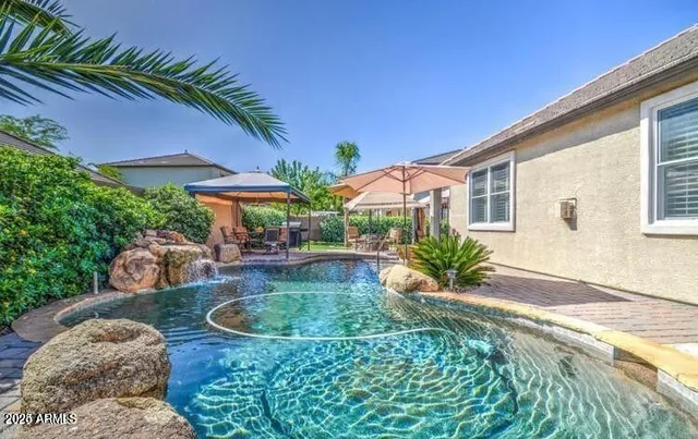 a view of an house with backyard outdoor seating area and furniture