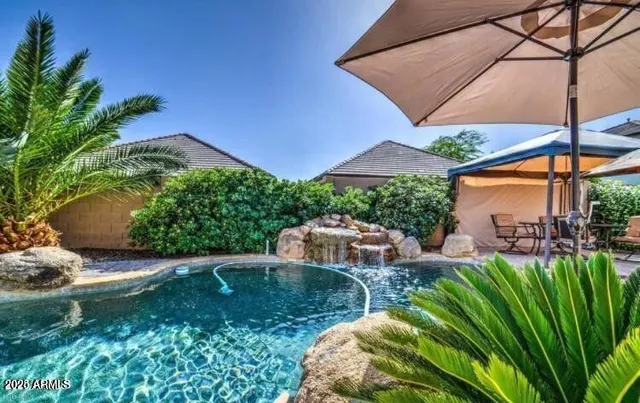 a view of backyard with outdoor seating and green space
