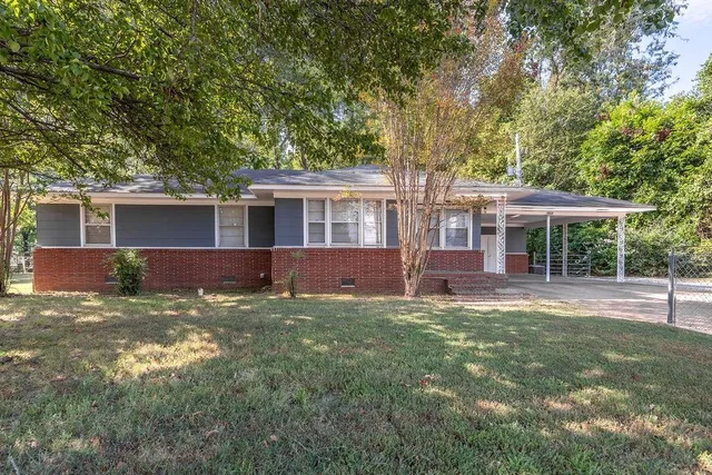 front view of a house with a yard