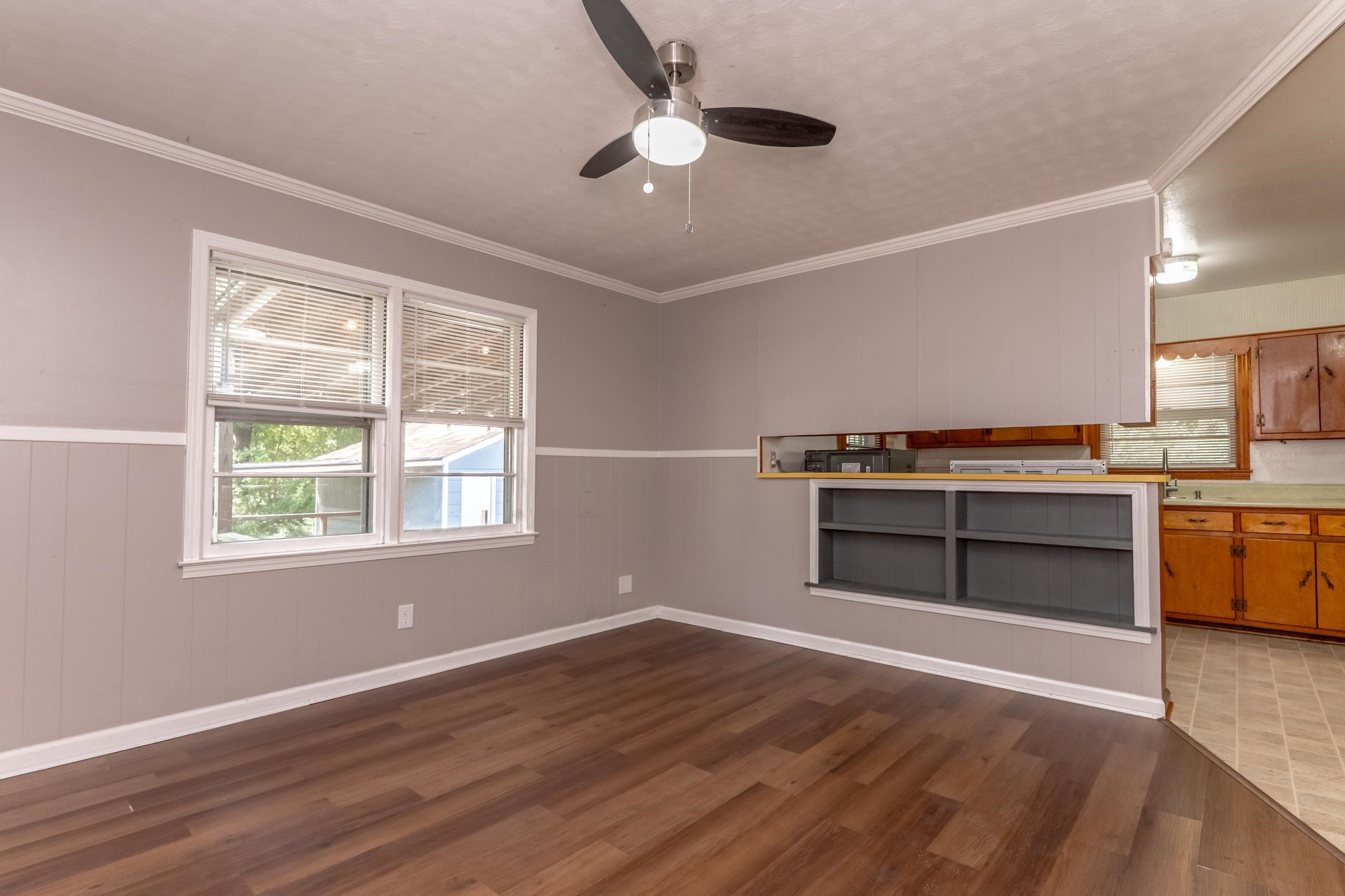 5595 Raleigh Lagrange Road Memphis, TN 38134 - Photo 13 of 29 a view of kitchen with wooden floor and windows