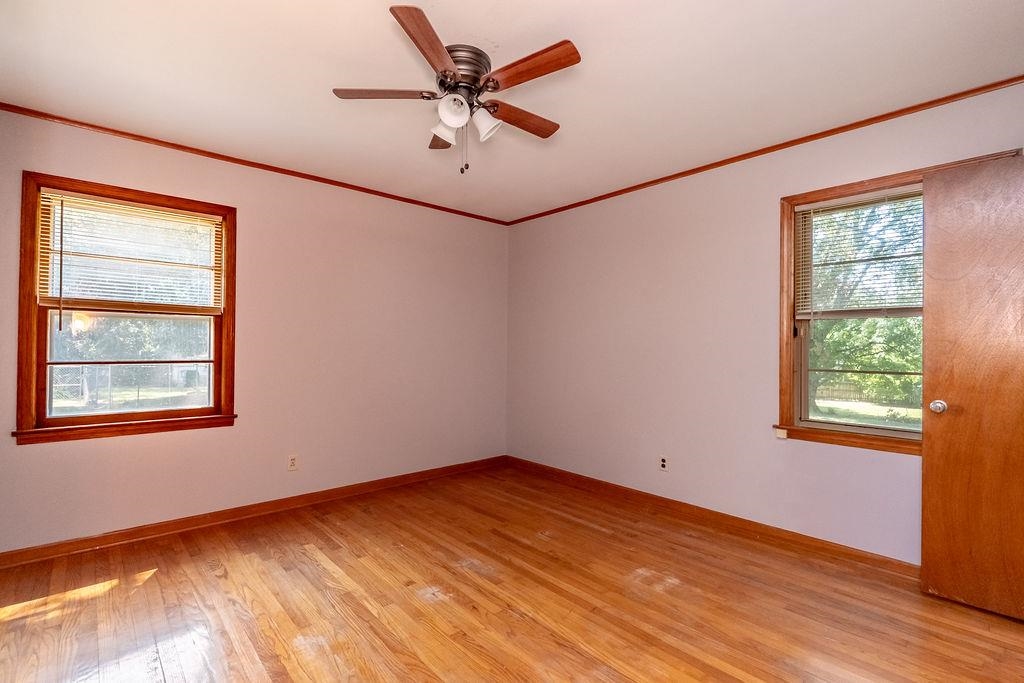 5595 Raleigh Lagrange Road Memphis, TN 38134 - Photo 16 of 29 an empty room with a window and a ceiling fan