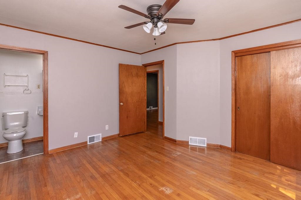 5595 Raleigh Lagrange Road Memphis, TN 38134 - Photo 17 of 29 a view of a room with wooden floor and bathroom view