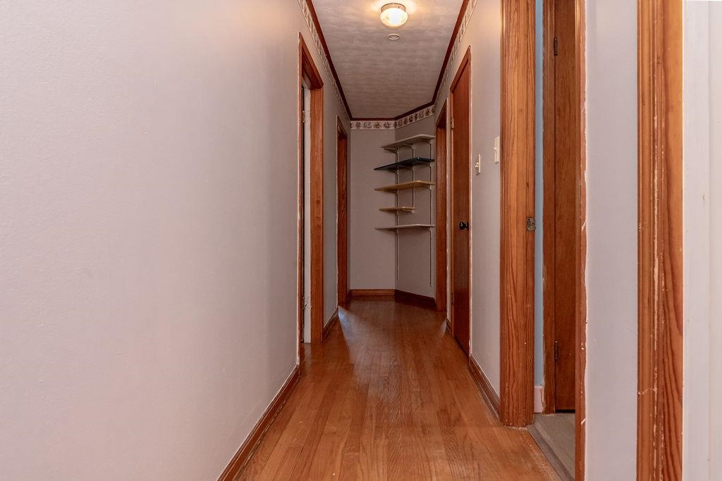 5595 Raleigh Lagrange Road Memphis, TN 38134 - Photo 19 of 29 a view of a hallway with wooden floor and staircase