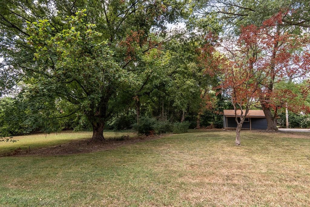 5595 Raleigh Lagrange Road Memphis, TN 38134 - Photo 7 of 29 a view of outdoor space with deck and yard
