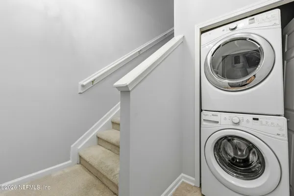 a utility room with dryer and washer