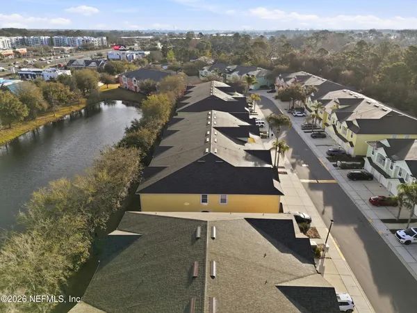 an aerial view of a house with a lake view