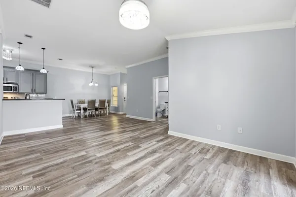a view of kitchen and dining room with wooden floor