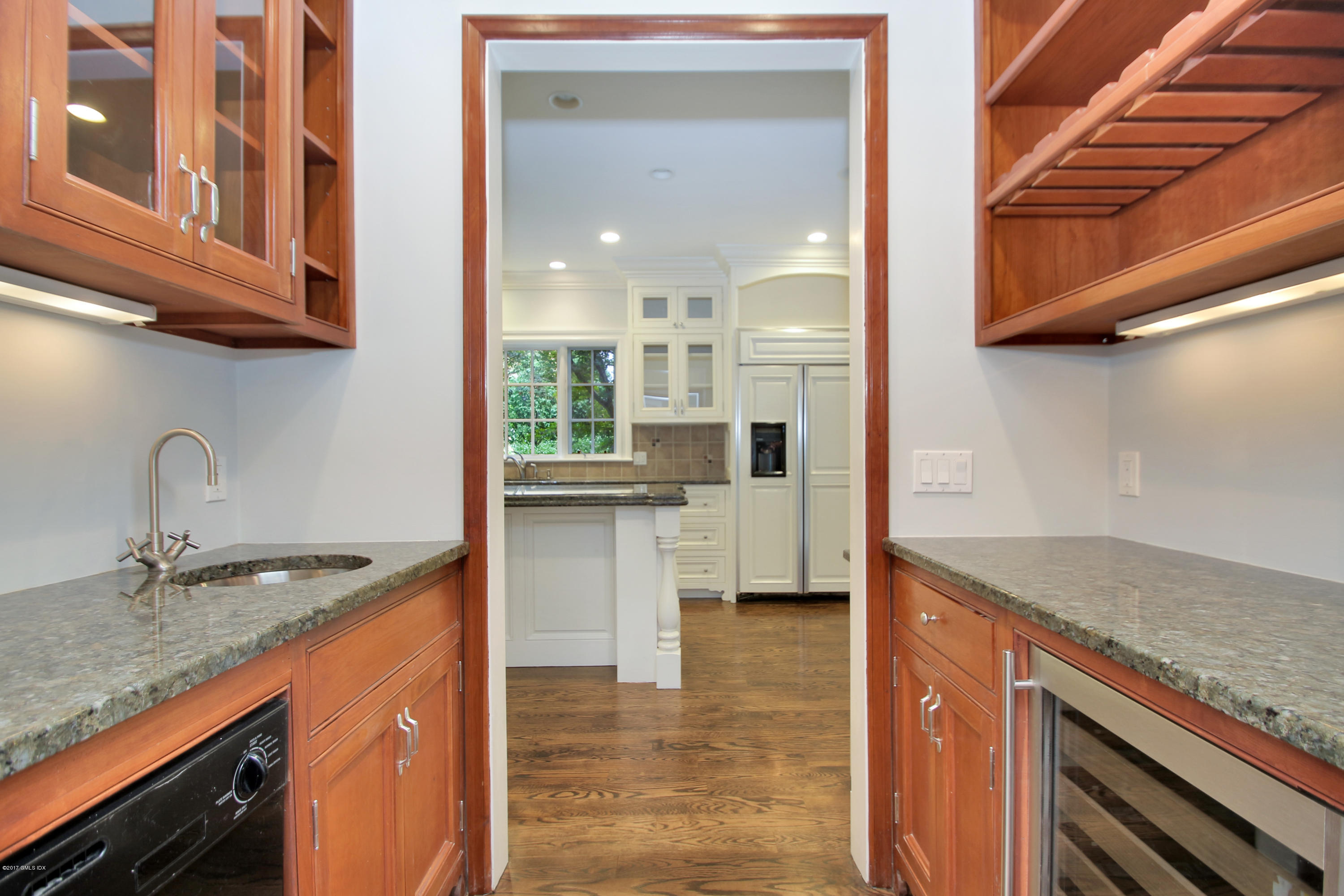 15 Juniper Lane Riverside, CT 06878 - Photo 11 of 36 a kitchen with stainless steel appliances granite countertop a sink and a stove