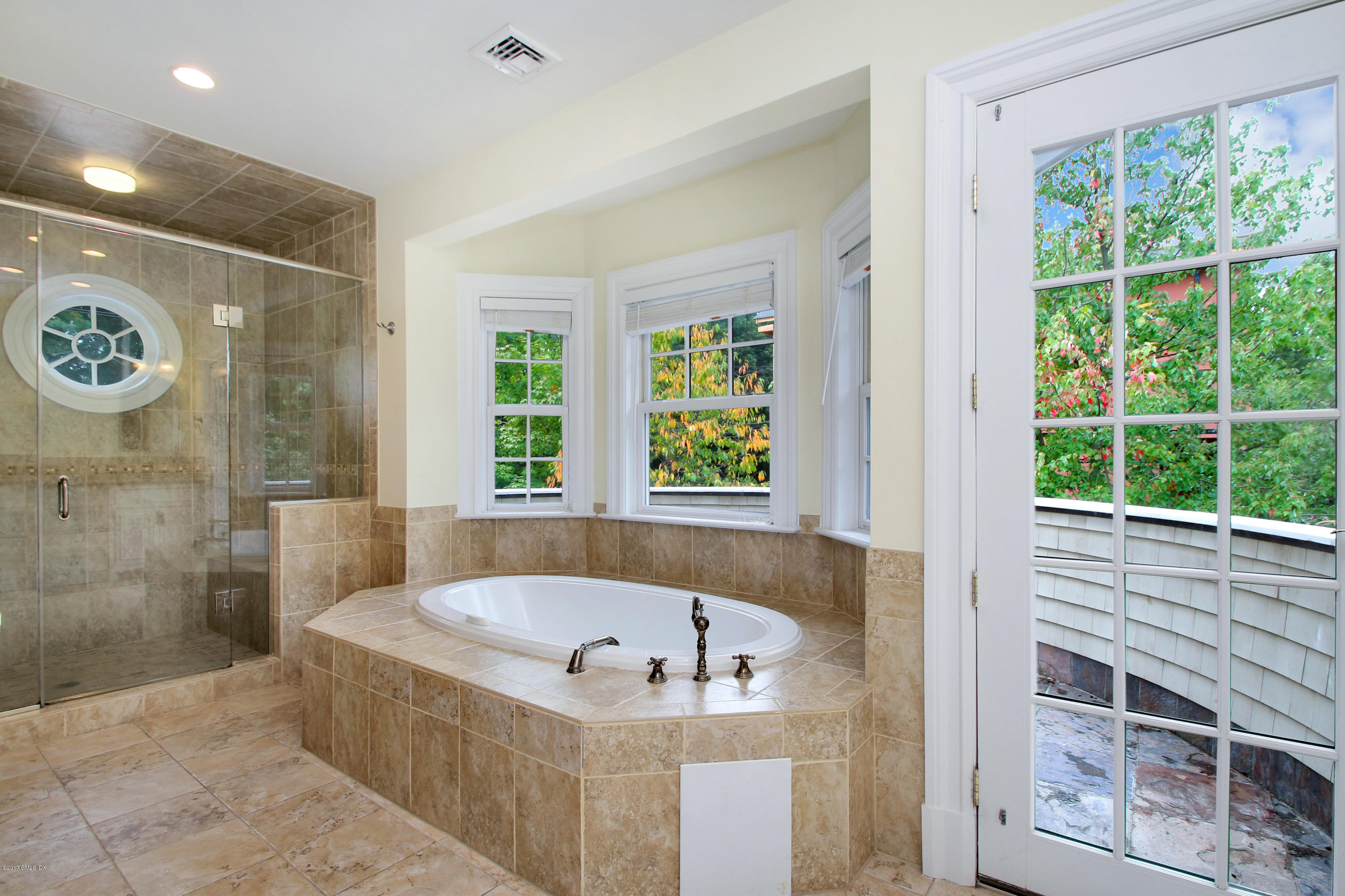 15 Juniper Lane Riverside, CT 06878 - Photo 15 of 36 a bathroom with a tub a window and a shower