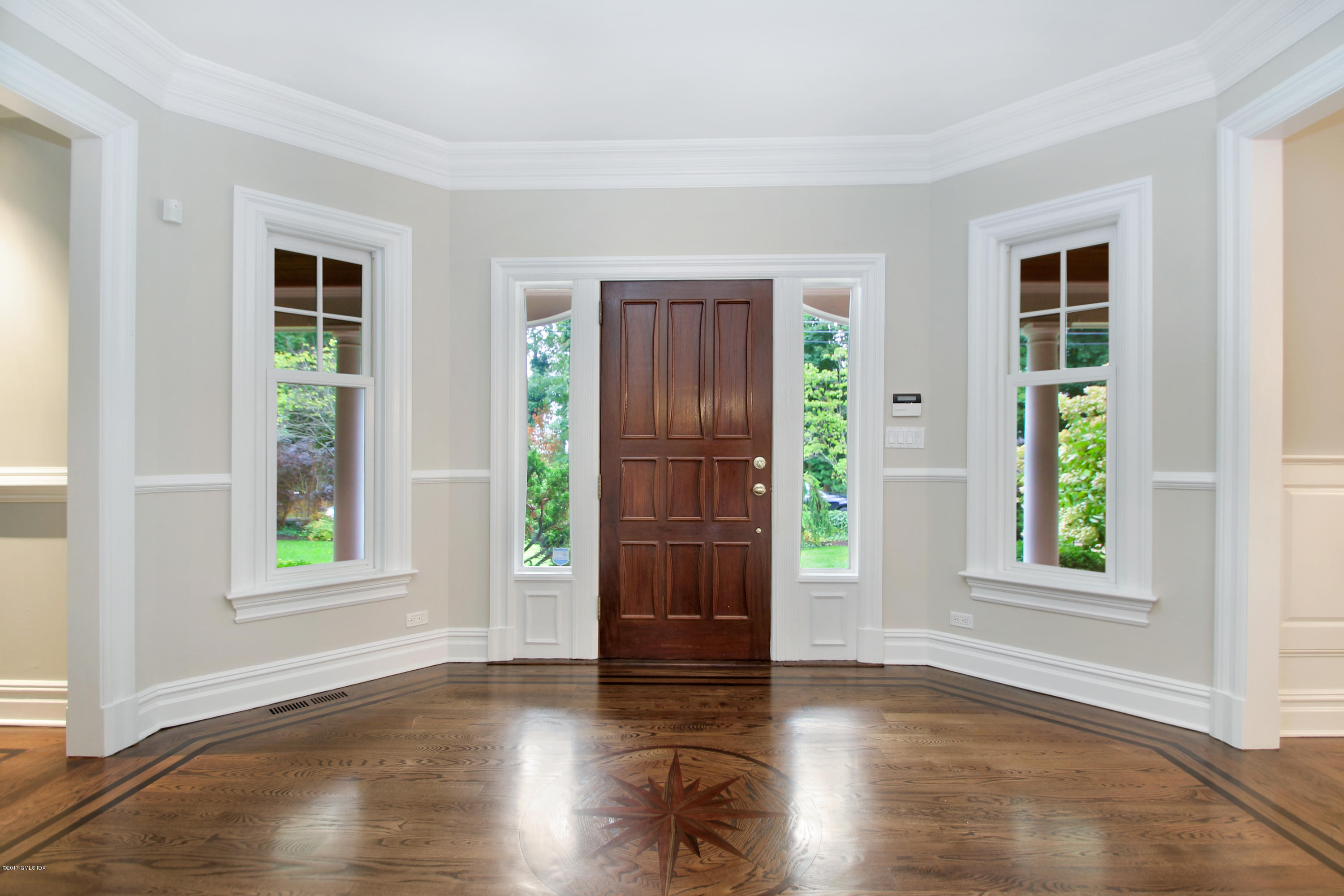 15 Juniper Lane Riverside, CT 06878 - Photo 3 of 36 a view of an empty room with window and wooden floor