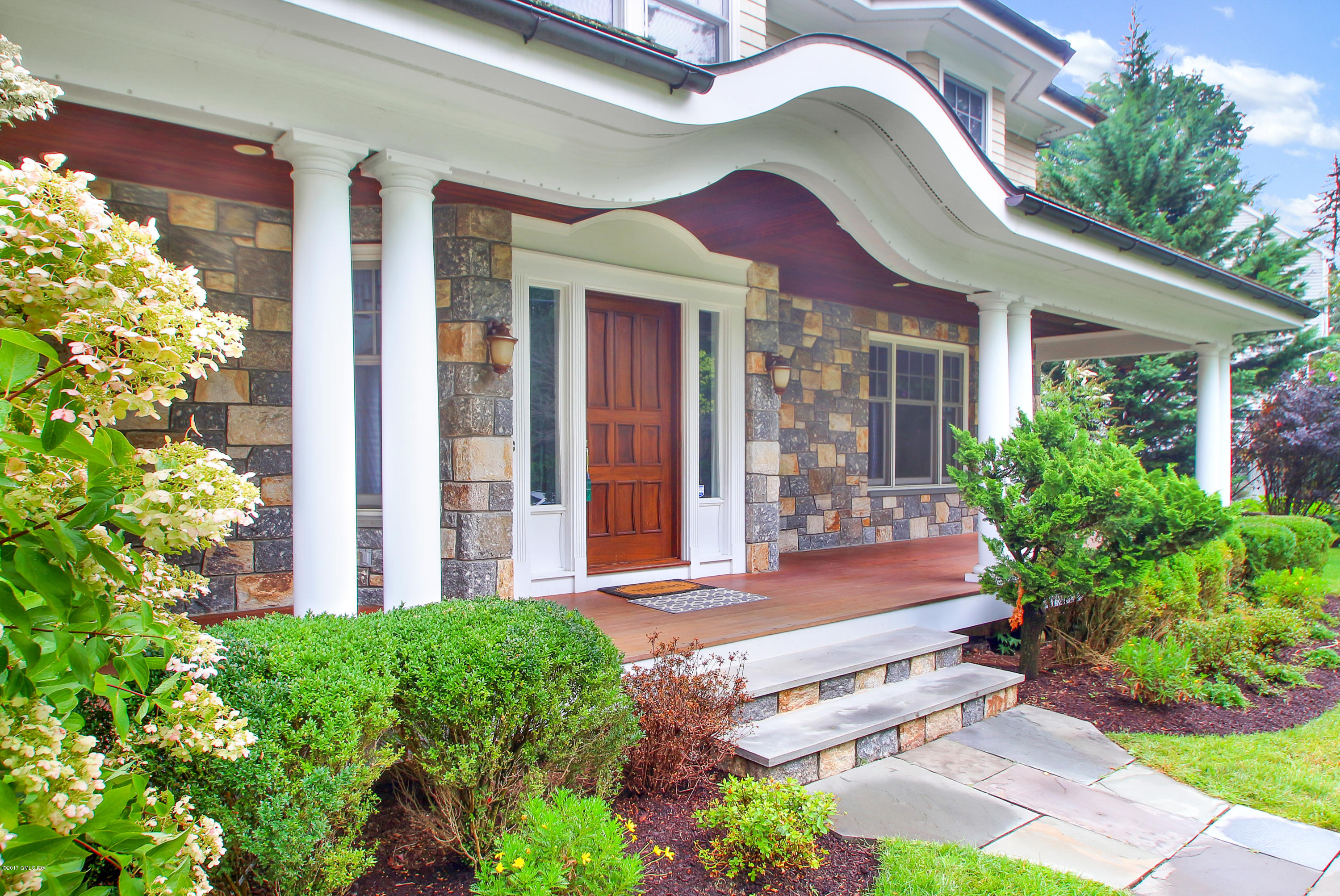 15 Juniper Lane Riverside, CT 06878 - Photo 32 of 36 a front view of a house with garden