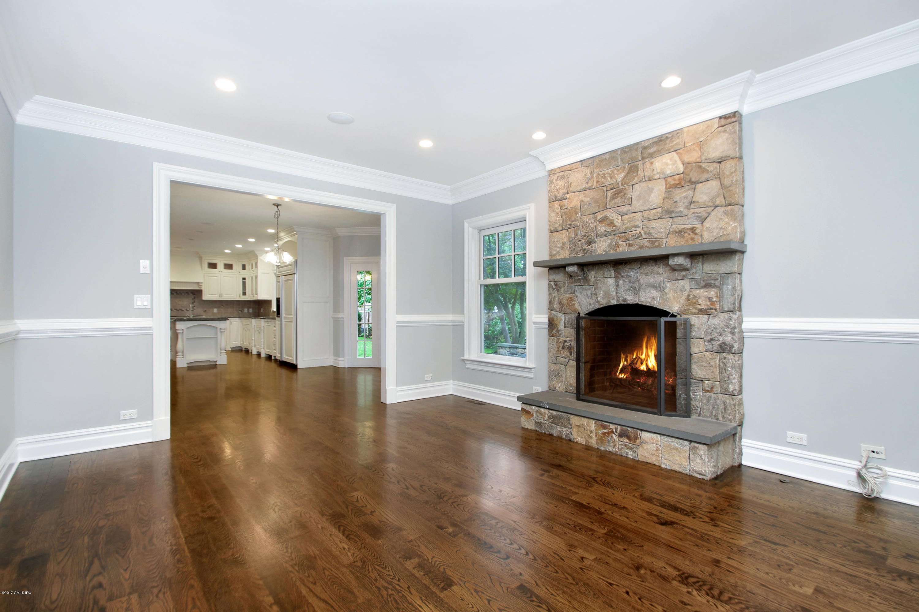 15 Juniper Lane Riverside, CT 06878 - Photo 5 of 36 a view of an empty room with a fireplace and wooden floor