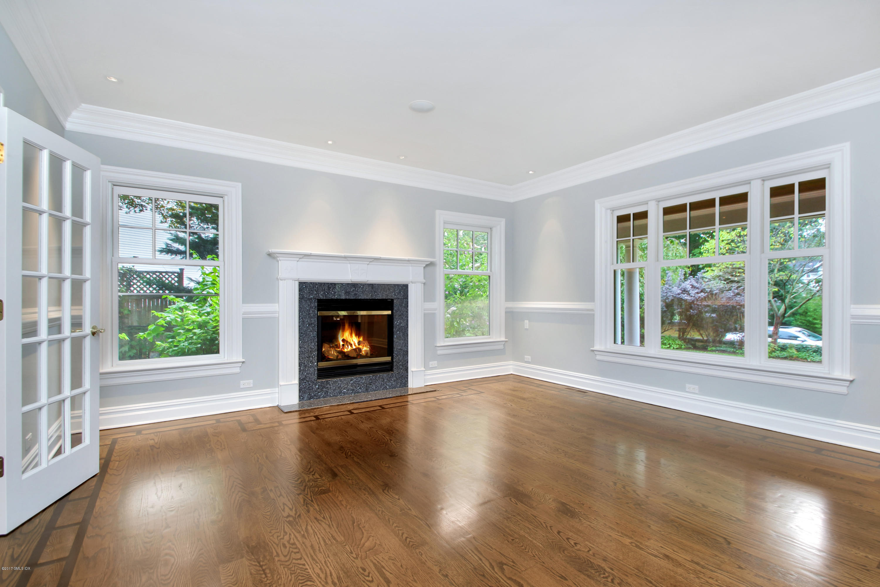 15 Juniper Lane Riverside, CT 06878 - Photo 6 of 36 a view of an empty room with wooden floor fireplace and a window