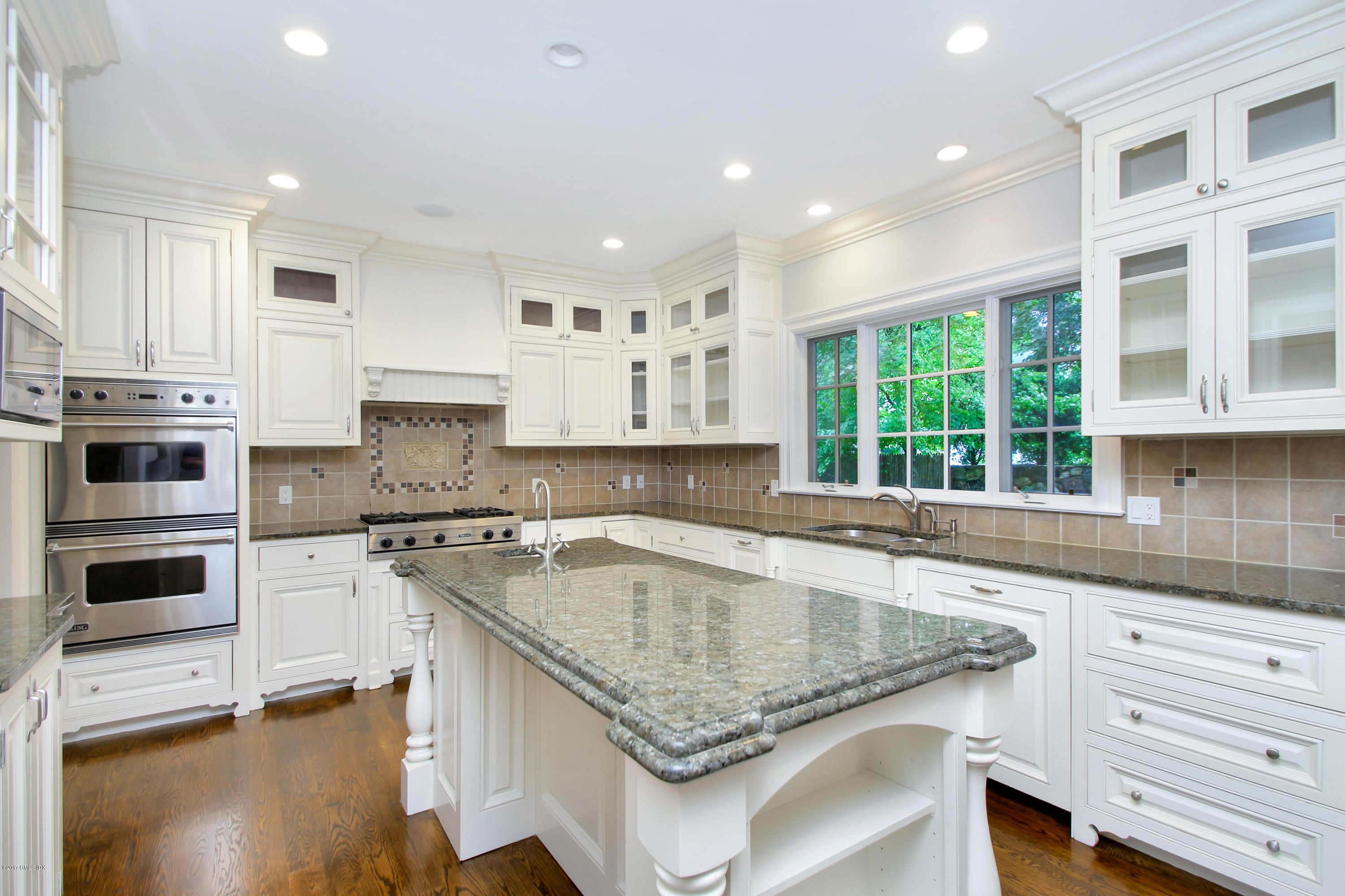 15 Juniper Lane Riverside, CT 06878 - Photo 9 of 36 a kitchen with stainless steel appliances granite countertop a sink stove and cabinets