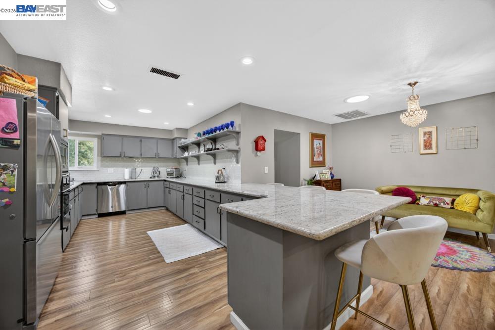 3590 Park Road Sacramento, CA 95841 - Photo 29 of 66 a kitchen with a table chairs and wooden floor
