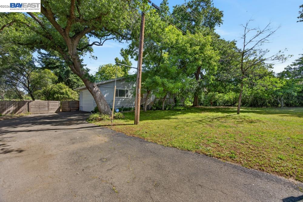 3590 Park Road Sacramento, CA 95841 - Photo 3 of 66 a view of a house with backyard and trees