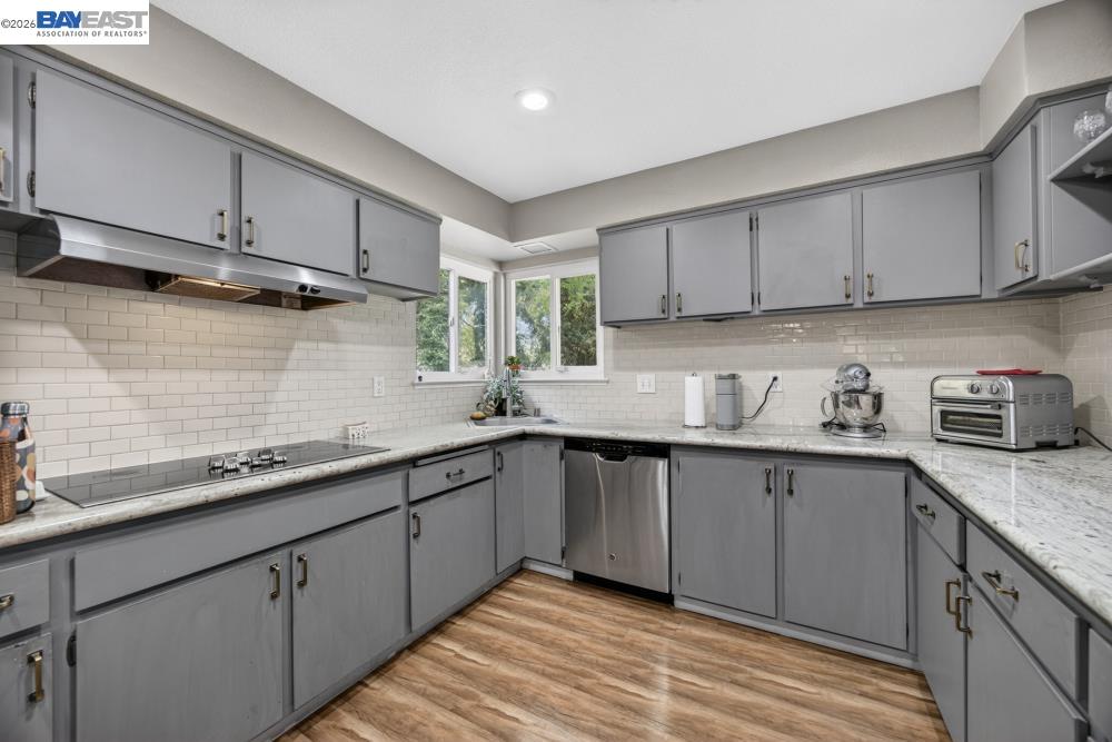 3590 Park Road Sacramento, CA 95841 - Photo 32 of 66 a kitchen with stainless steel appliances granite countertop a sink stove and cabinets