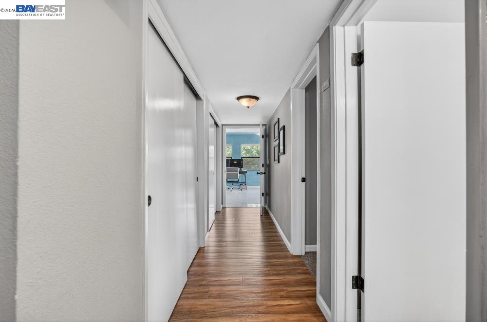 3590 Park Road Sacramento, CA 95841 - Photo 42 of 66 a view of a hallway with wooden floor and staircase