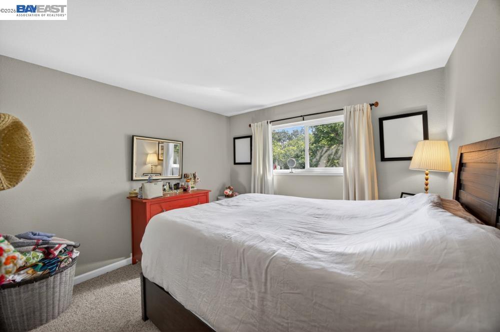 3590 Park Road Sacramento, CA 95841 - Photo 45 of 66 a bedroom with a bed and wooden floor